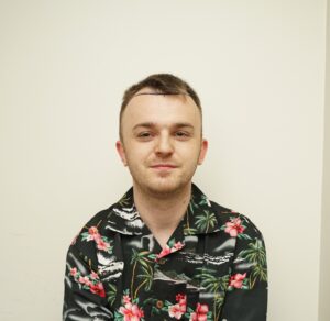 Frontal photo of an individual with balanced medium hair density and even coverage.
